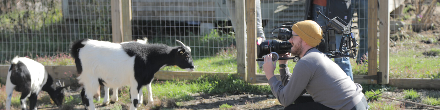 Erik Gruber operating a camera on location